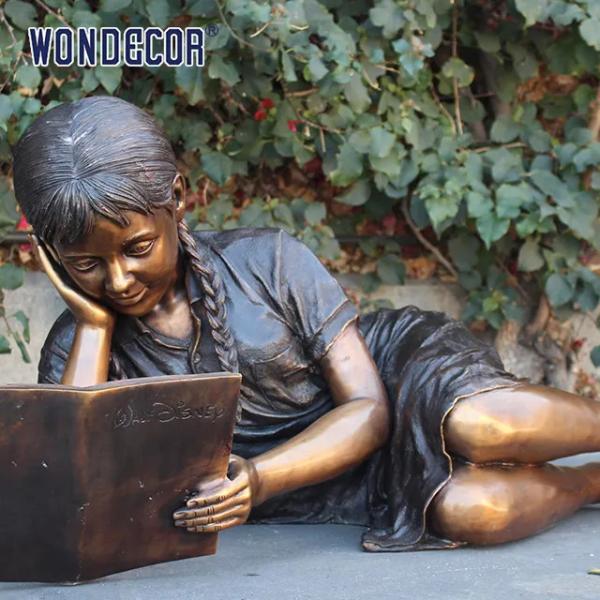 Customized garden decoration, life-size bronze statue of a girl lying on her side reading a book