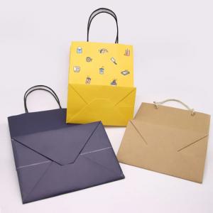 China Kraft Paper Packaging Bag Gift Crafts Shopping Biodegradable Bag With Twisted Handle on sale